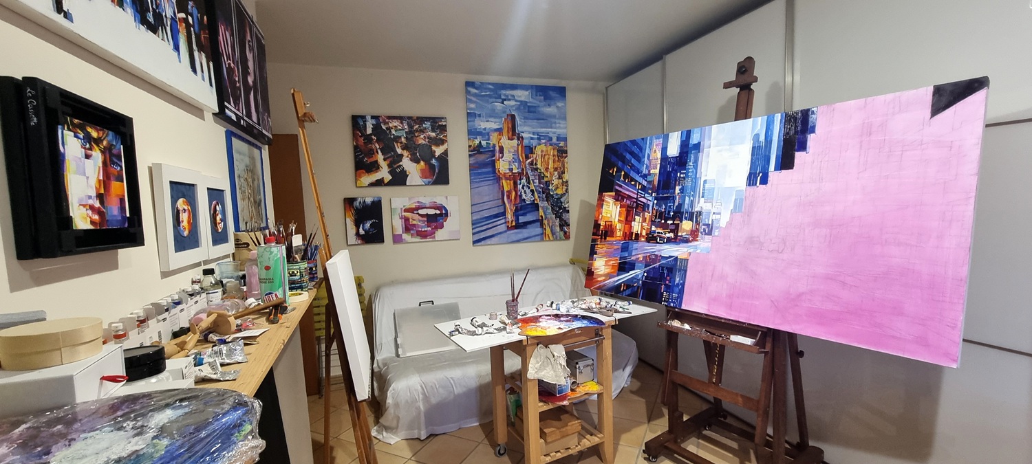 Assunta Cassa’s art studio featuring palette knife paintings, figurative artworks, and oil painting materials.