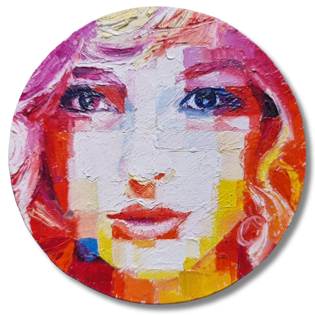 Close-up of 'Lunar Aurora' artwork, a vivid female portrait painted on plywood using palette knife techniques by Assunta Cassa. The portrait features intense blue eyes and a rich interplay of red, yellow, and white colors, capturing the mystical and emotional essence of the moon's influence.