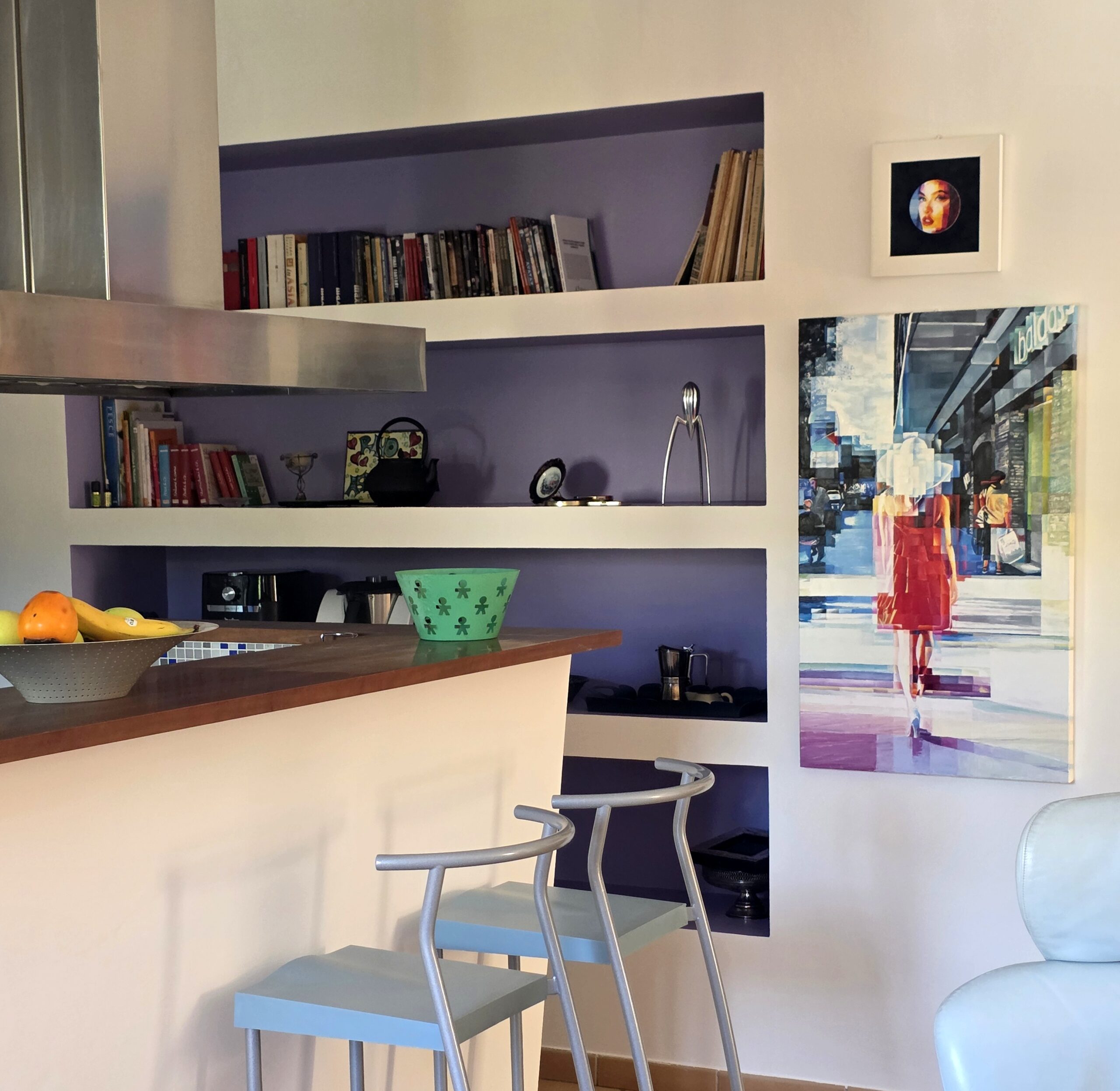 The Power of Colors — The Charm of Violet at Home the power of colors — violet bookshelf wall with colorful painting