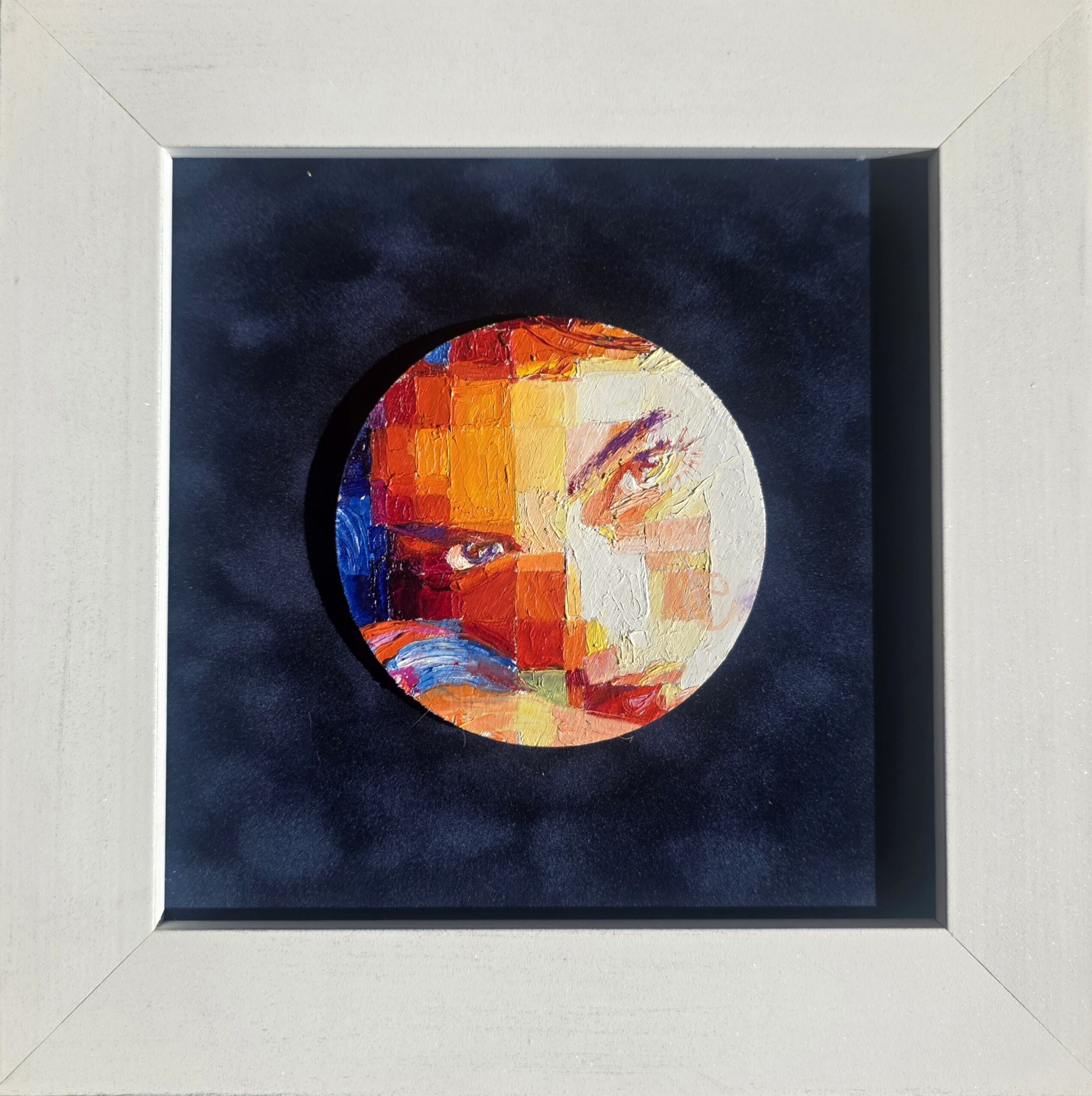 Incandescent Moon framed on blue background, lit by side sunlight